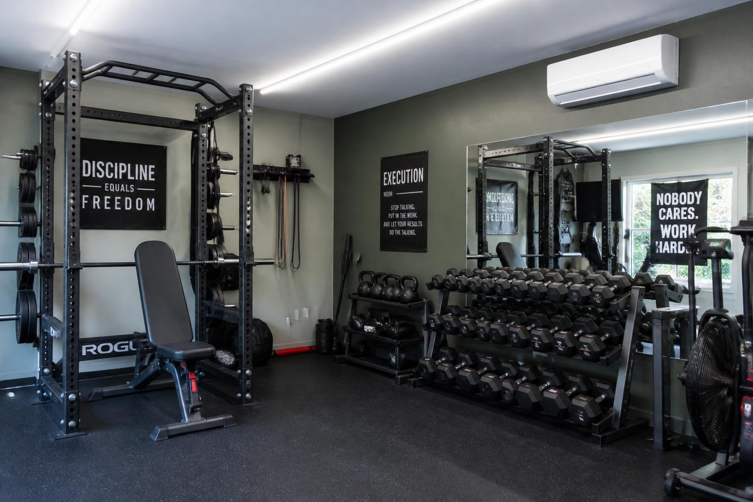 Garage gym with rubber flooring and mini-split